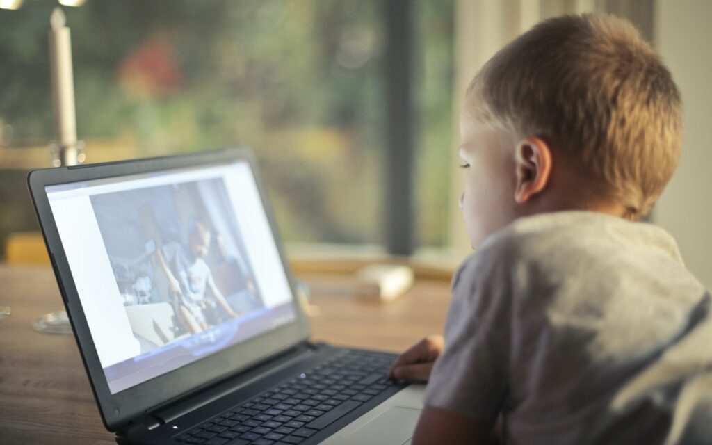 Boy Watching Video Using Laptop